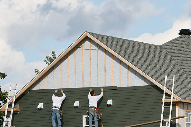 Professional Siding technician working in Stoneham, MA
